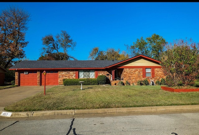 single story home featuring a front yard and a garage