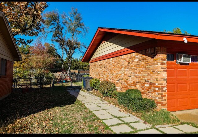 6917 Jewell Ave, Fort Worth, TX 76112 - view of home's exterior featuring a gate and fence