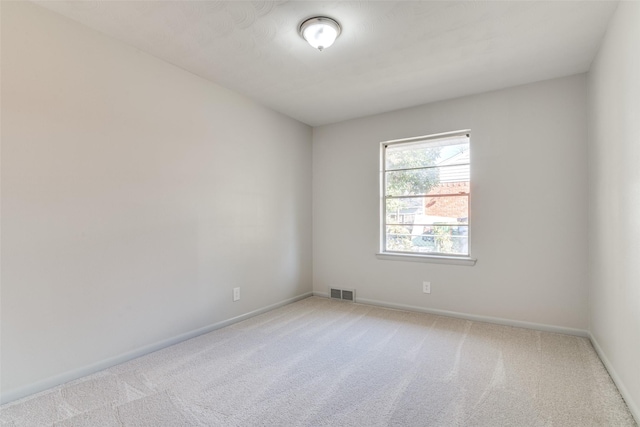 empty room featuring light colored carpet