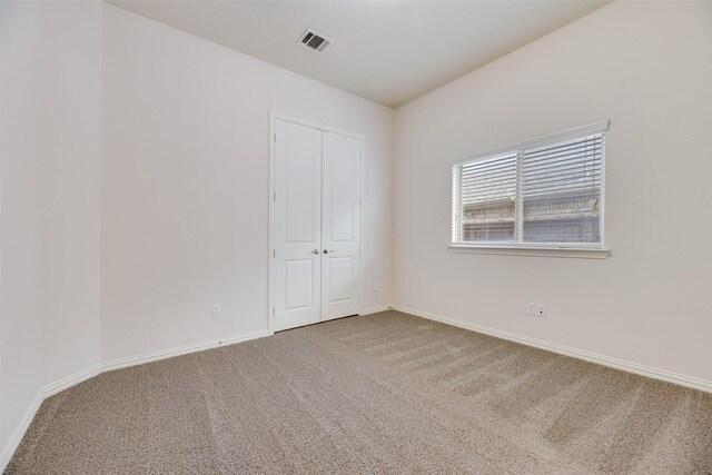 unfurnished room featuring carpet flooring