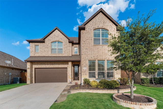 view of front of home with a front lawn, central AC unit, and a garage