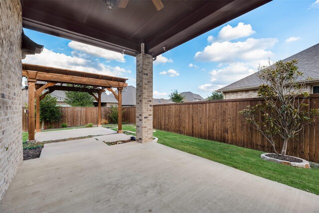 view of patio / terrace with a pergola and ceiling fan