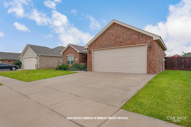 view of front of home with a front lawn and a garage