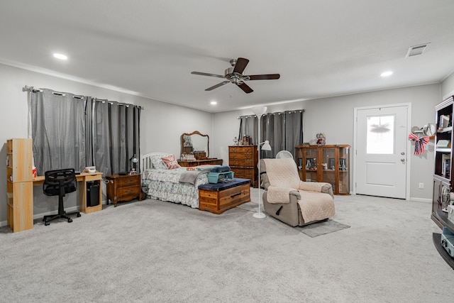 bedroom with ceiling fan and light colored carpet