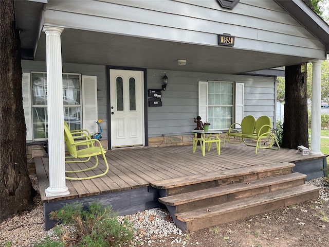 wooden deck featuring covered porch