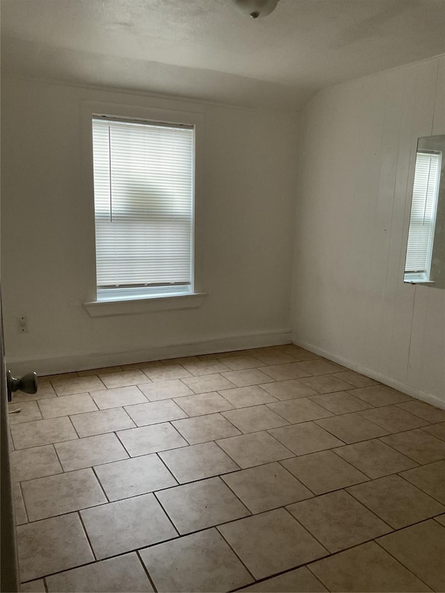 empty room featuring light tile patterned floors