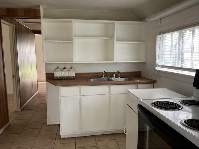 kitchen featuring light tile patterned flooring, sink, white cabinets, and white electric range oven