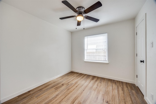 spare room featuring light hardwood / wood-style floors and ceiling fan