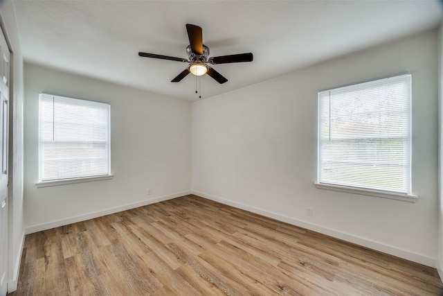 spare room with ceiling fan and light hardwood / wood-style floors