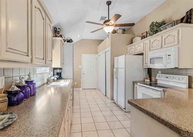 kitchen featuring white appliances, backsplash, vaulted ceiling, and sink