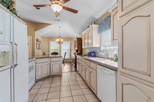 507 Azalea Dr, Forney, TX 75126 - kitchen with white appliances, a sink, plenty of natural light, and a peninsula