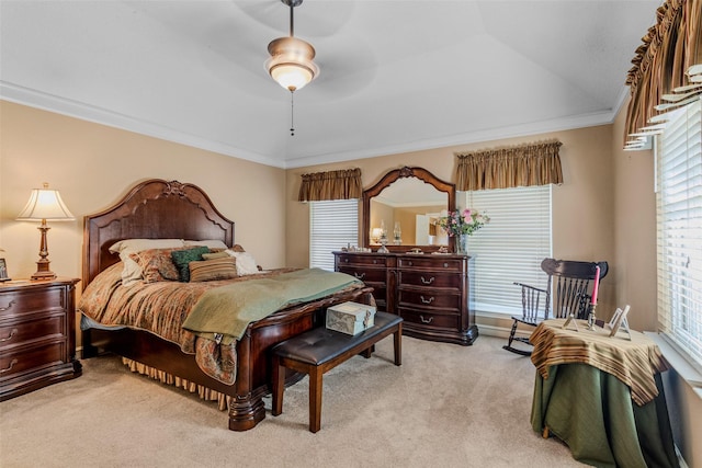 carpeted bedroom featuring lofted ceiling, ceiling fan, and ornamental molding