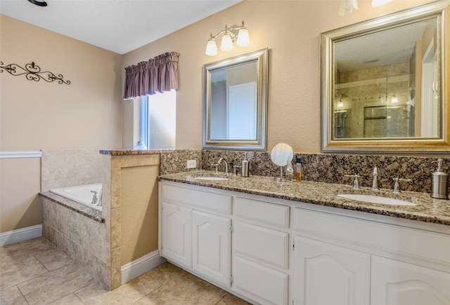 bathroom featuring tile patterned flooring, vanity, a textured ceiling, and plus walk in shower