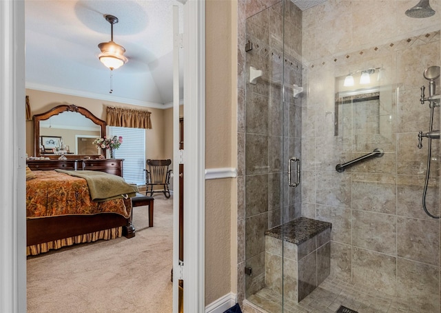 bathroom with crown molding, a shower with shower door, and vaulted ceiling