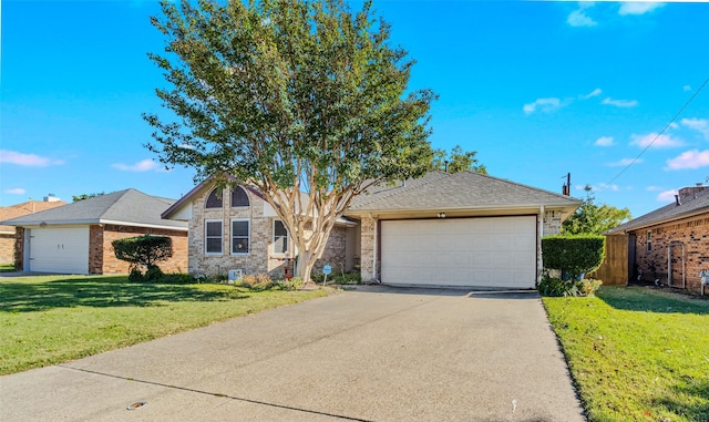 ranch-style house featuring a front lawn and a garage