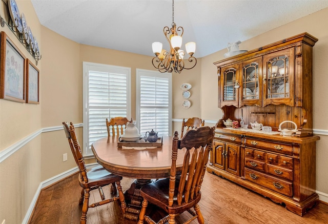 507 Azalea Dr, Forney, TX 75126 - dining area with light wood-style flooring, a chandelier, and baseboards