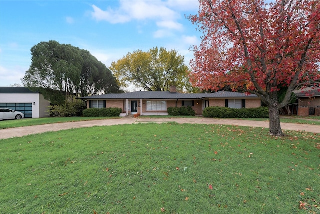 ranch-style home featuring a front yard