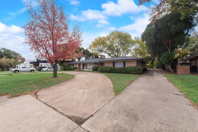 ranch-style home featuring a front yard