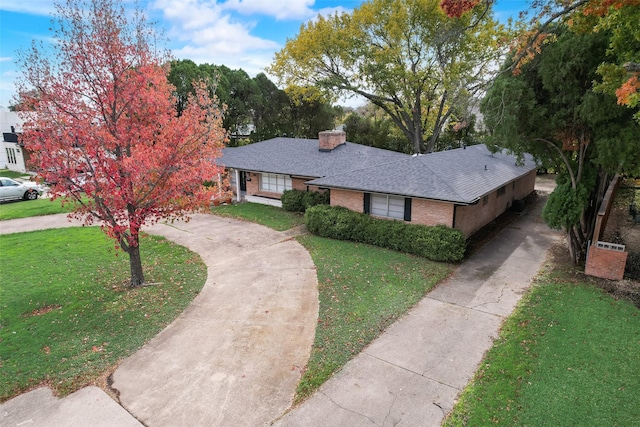 single story home with a front yard