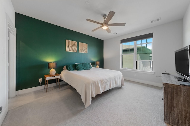 carpeted bedroom featuring ceiling fan