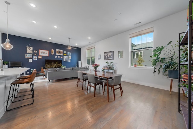 dining room featuring ceiling fan and dark hardwood / wood-style flooring