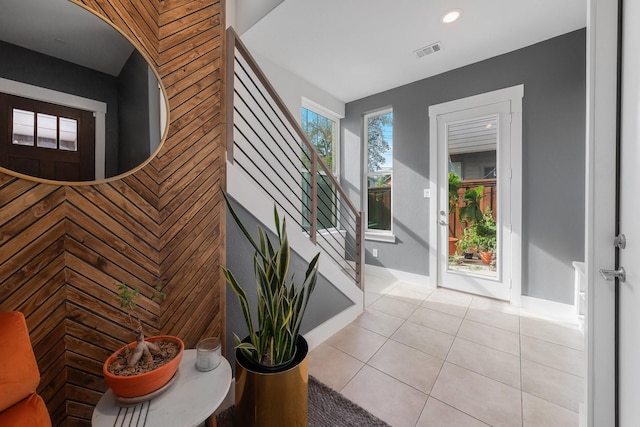 entryway with light tile patterned flooring