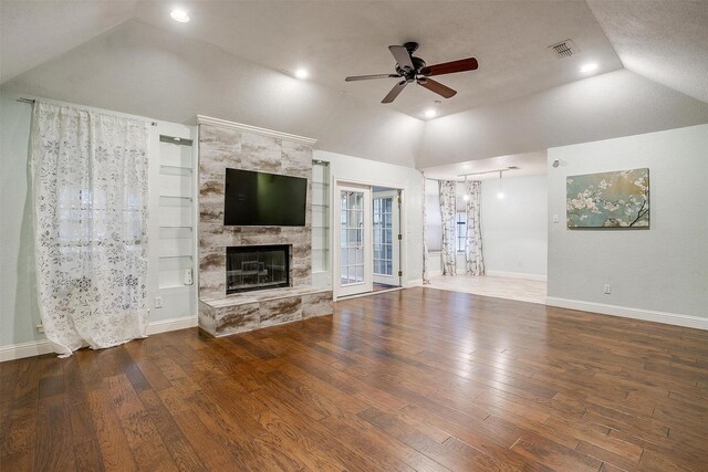 kitchen with white cabinetry, stainless steel appliances, backsplash, a textured ceiling, and light wood-type flooring