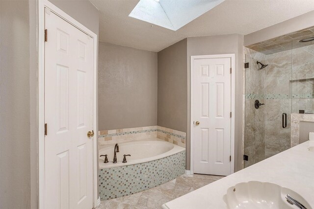 bathroom with vanity, a textured ceiling, and toilet