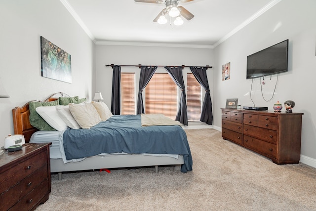 carpeted bedroom with ceiling fan and crown molding