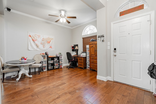 foyer entrance with hardwood / wood-style flooring, ceiling fan, and ornamental molding