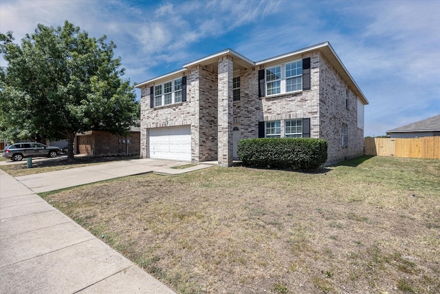 view of front of home featuring a garage and a front lawn