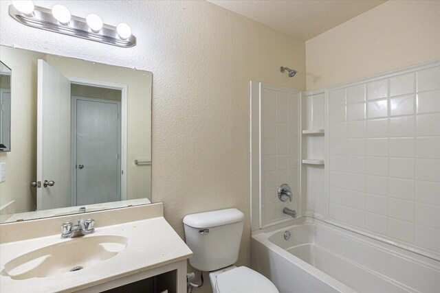 full bathroom featuring vanity, tub / shower combination, and toilet