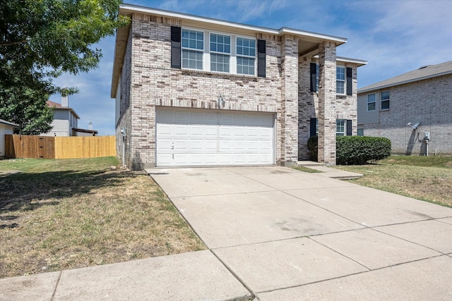 view of front of house featuring a garage and a front yard