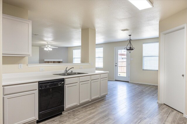 kitchen featuring dishwasher, white cabinets, light hardwood / wood-style flooring, and sink