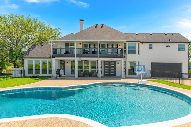 view of swimming pool featuring french doors and a patio area