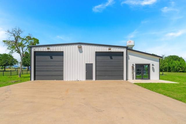 garage with a yard