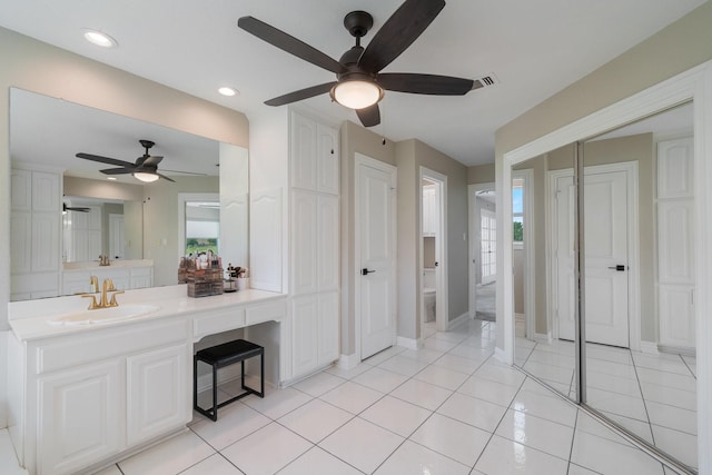 bathroom with tile patterned floors, ceiling fan, toilet, and vanity