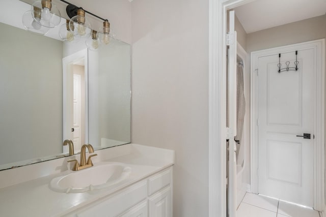 bathroom featuring tile patterned flooring and vanity