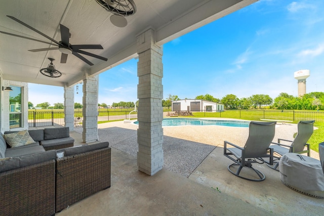 view of patio / terrace featuring ceiling fan, a fenced in pool, and an outdoor hangout area