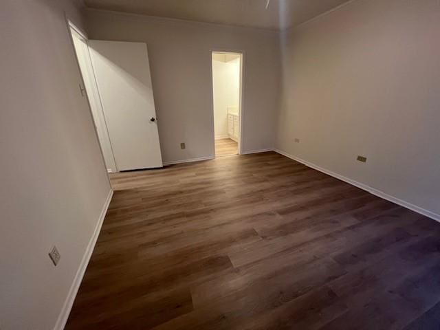 empty room with dark wood-type flooring