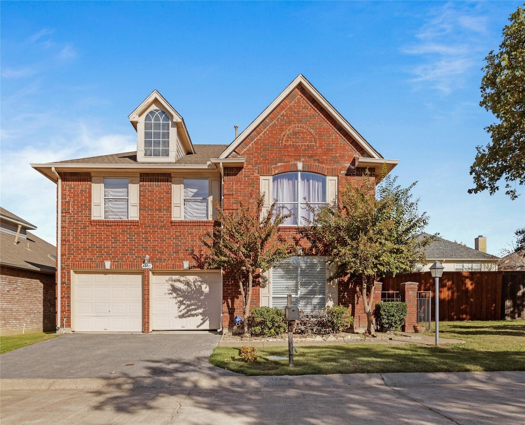 view of front facade featuring a garage and a front yard