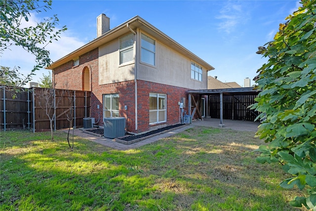 4307 Sausalito Dr, Dallas, TX 75287 - rear view of property featuring a yard and central air condition unit