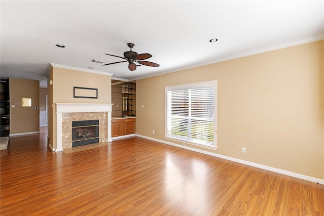 4307 Sausalito Dr, Dallas, TX 75287 - unfurnished living room with wood-type flooring, ornamental molding, a premium fireplace, and ceiling fan