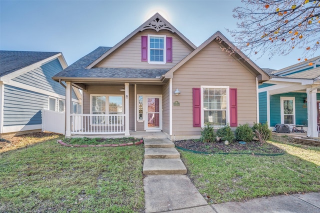 view of front of house featuring a front lawn and covered porch