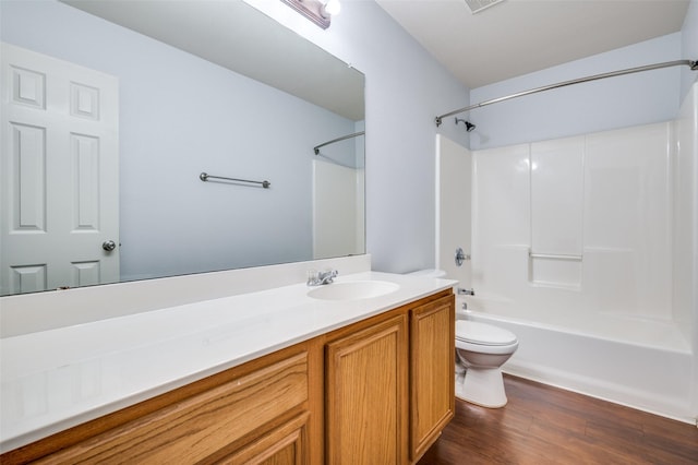 full bathroom featuring hardwood / wood-style floors, vanity, shower / bathtub combination, and toilet