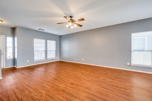 unfurnished room with ceiling fan and light wood-type flooring