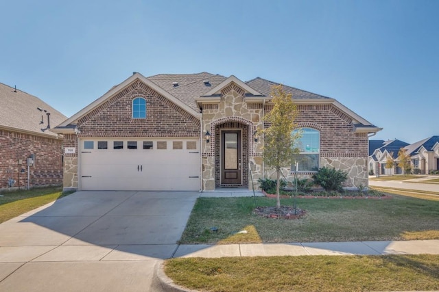 front of property featuring a front yard and a garage