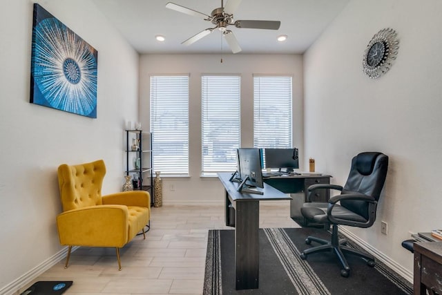 home office with light hardwood / wood-style floors, plenty of natural light, and ceiling fan