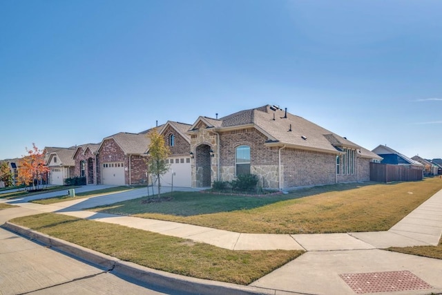 view of front of house featuring a garage and a front yard