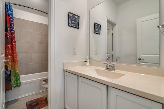 full bathroom with vanity, shower / bathtub combination with curtain, wood-type flooring, and toilet